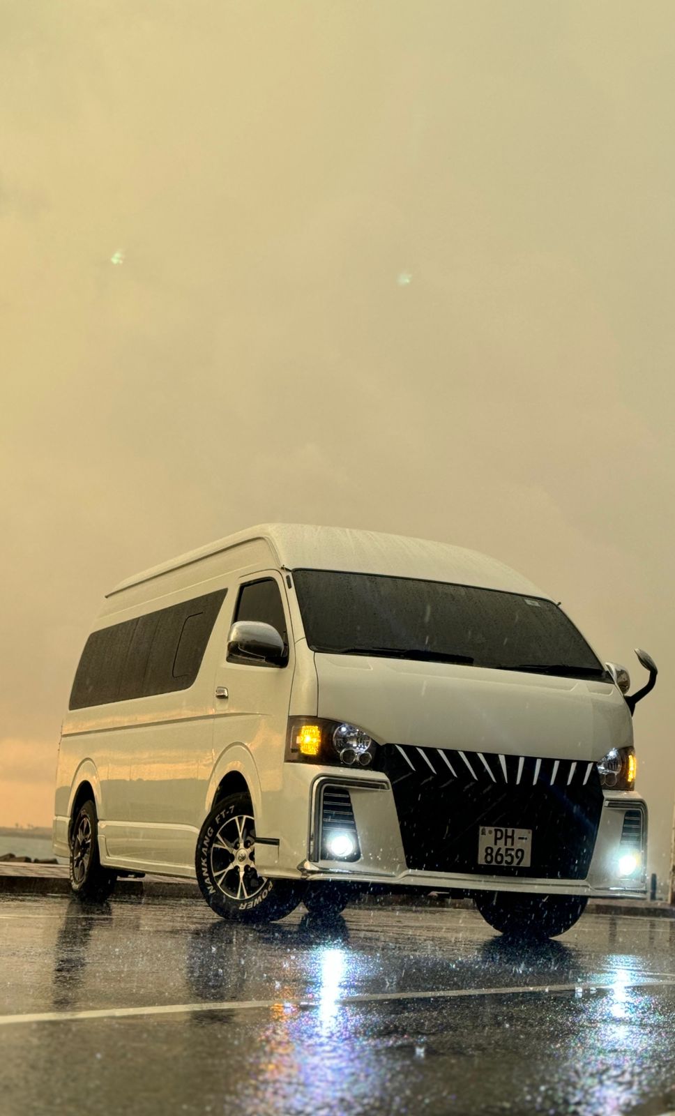 Pinto Tours van on a coastal road in Sri Lanka