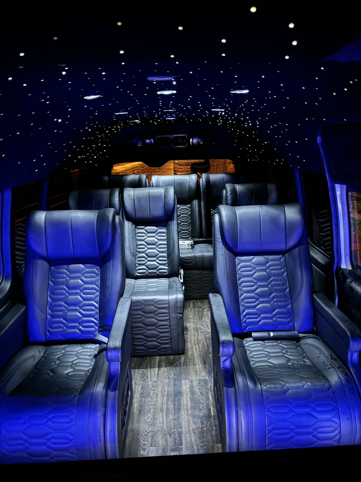 Van interior with quilted leather captain seats and starlight roof
