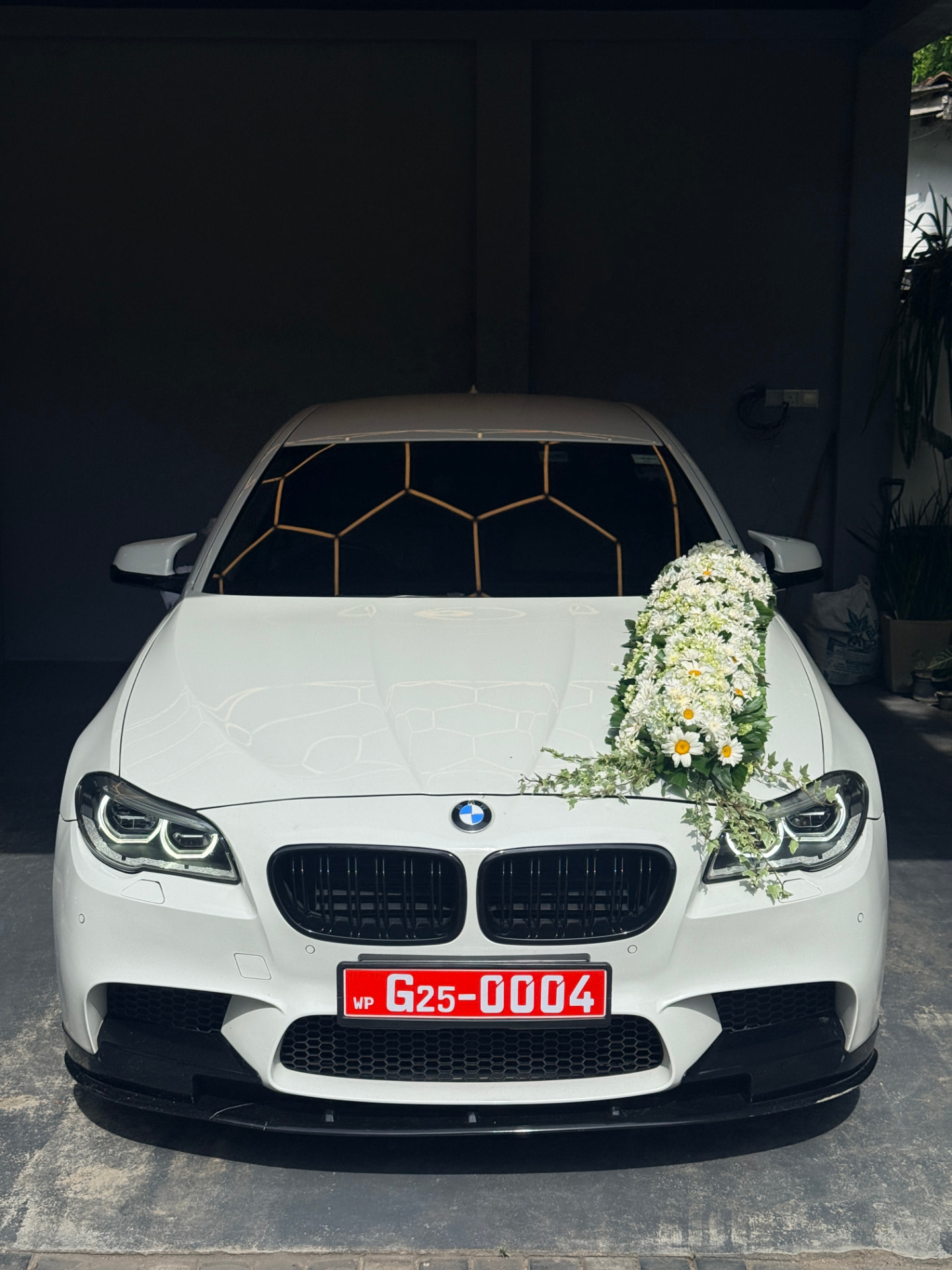 Front view of the white BMW dressed for a wedding