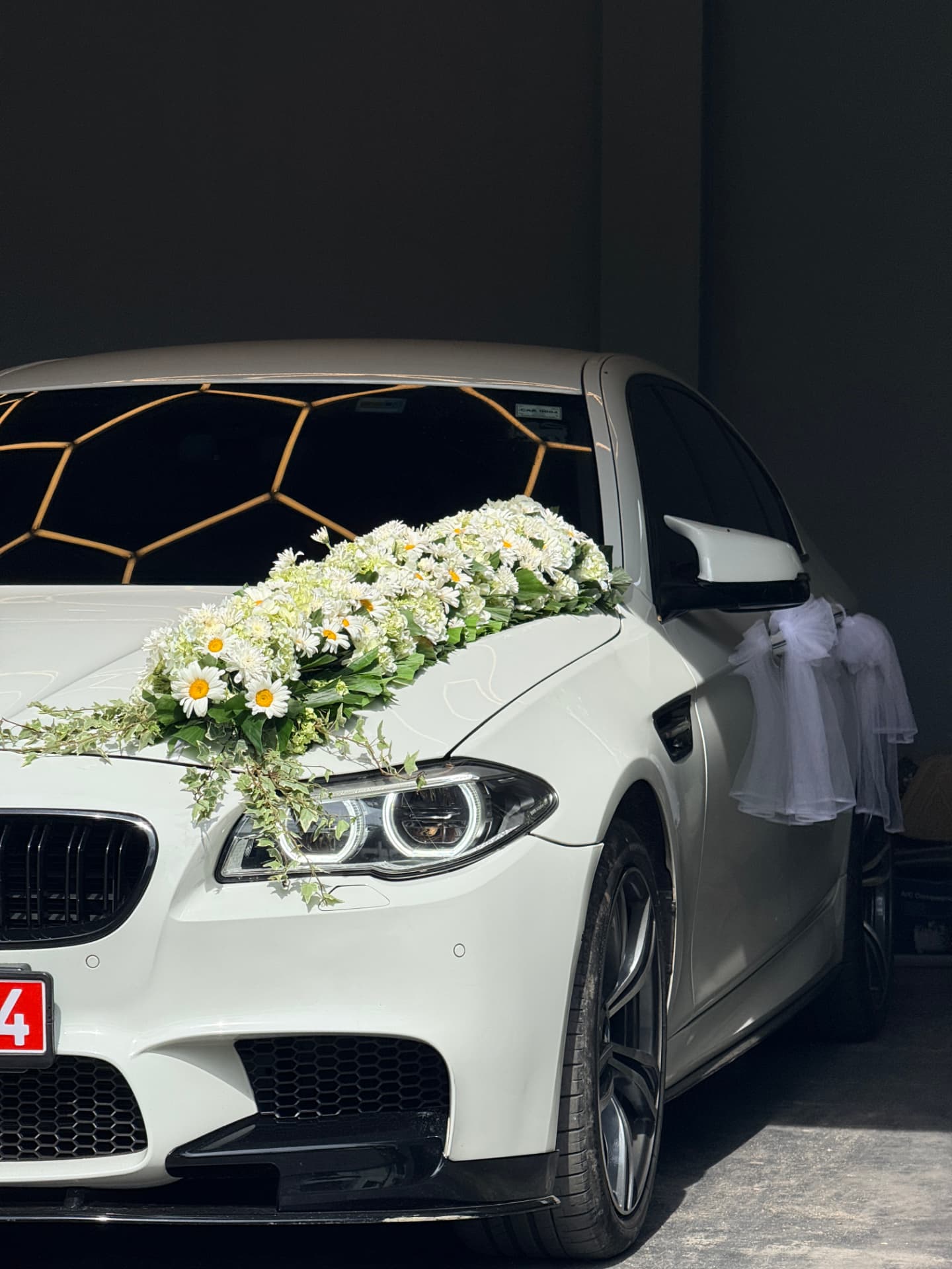 Close detail of the floral arrangement on the BMW bonnet